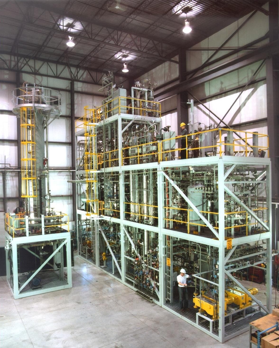 Multi-level modular process plant under assembly in a Petro Sep fabrication shop.
