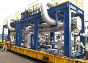 Modular process unit with insulated piping loaded on a transport frame for delivery to site.