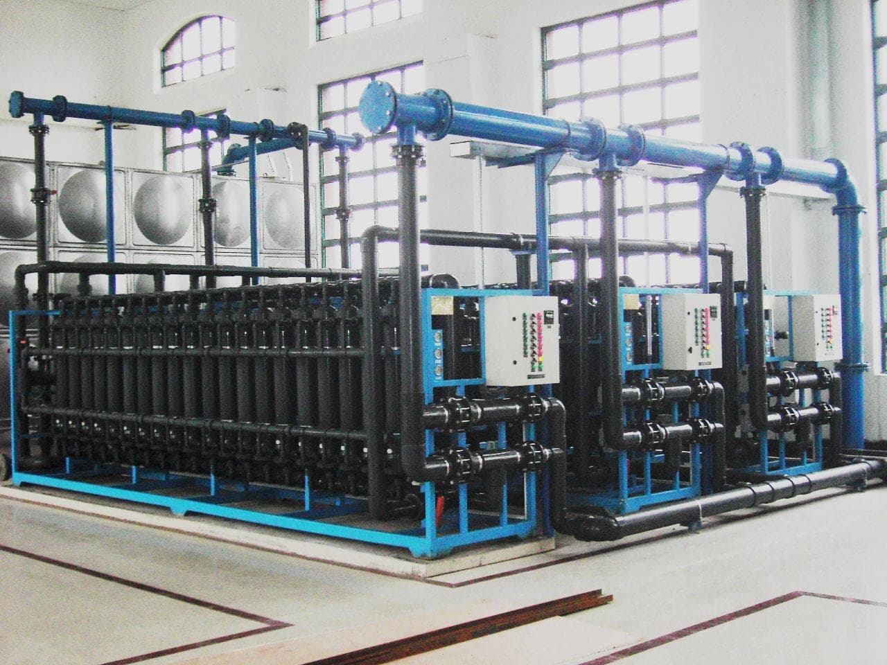 Membrane distillation modules in an industrial enclosure.